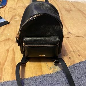 Small black coach backpack that never peen used